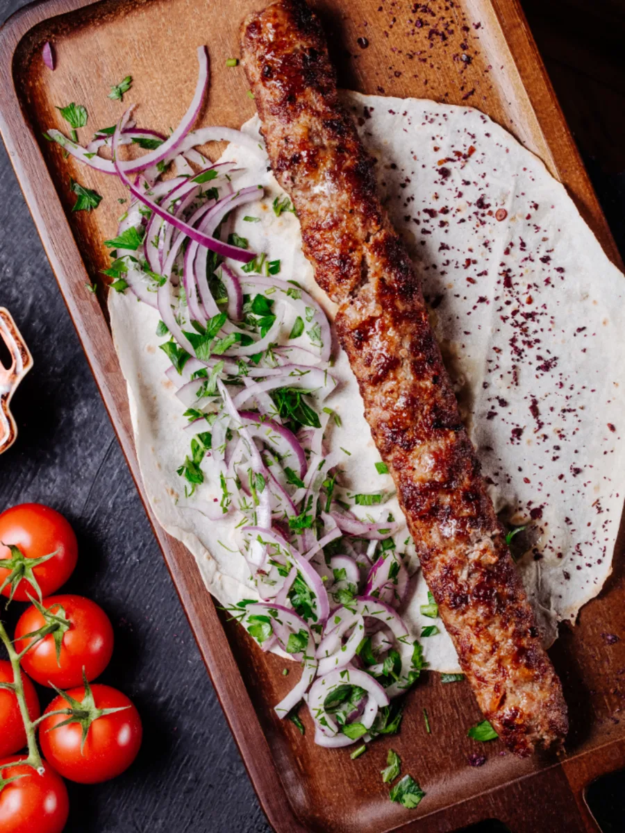 Adana kebab with onion and fresh parsley